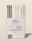 Kese traditional Turkish exfoliating glove packaging with 'banyo' branding on a beige background