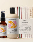 Banyo brand products including a bottle of body wash, a bottle of oil, and a glove on a beige background