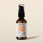 Bottle of Petal Woods Aromatic Body Oil by banyo on a beige background