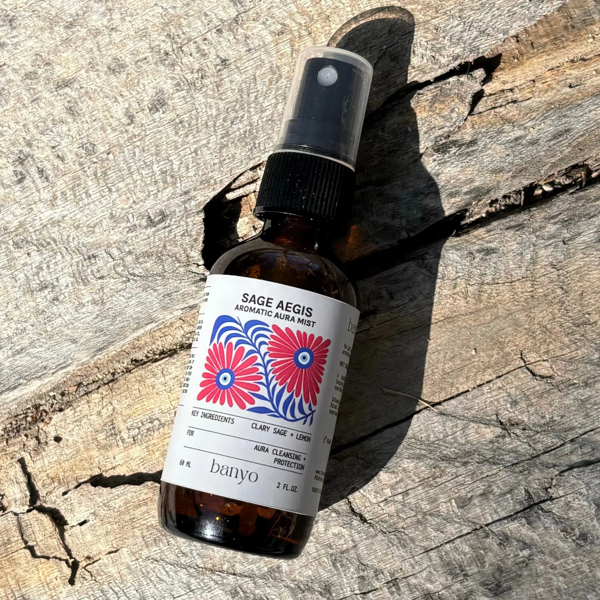 Bottle of Sage Aegis aromatic aural mist by banyo on a wooden surface