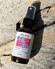 Bottle of Sage Aegis aromatic aural mist by banyo on a wooden surface