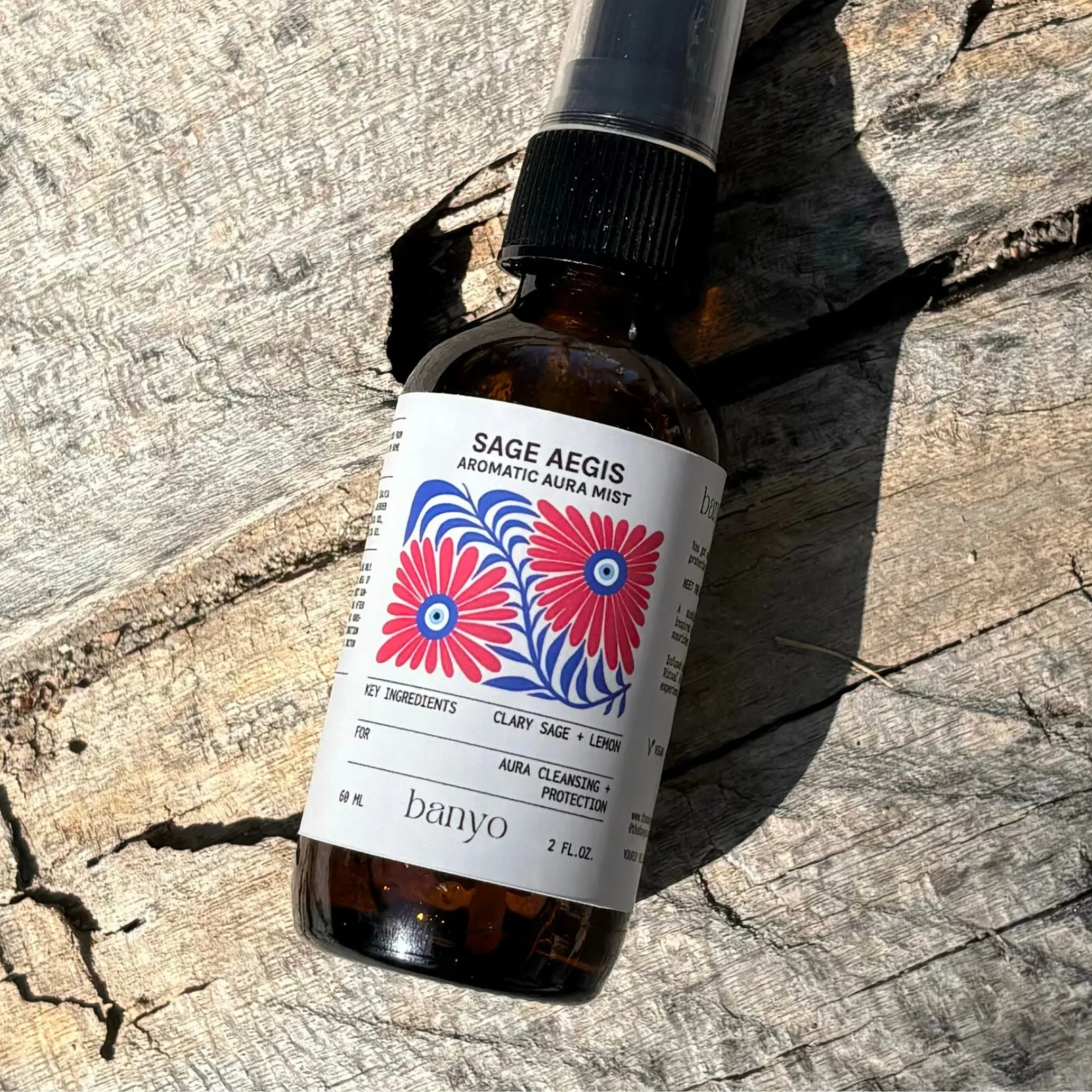 Bottle of Sage Aegis aromatic aural mist by banyo on a wooden surface