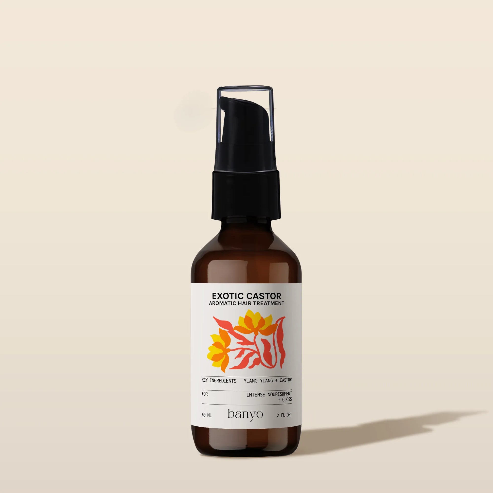 Brown bottle of Exotic Castor hair treatment with a label on a beige background