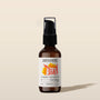 Brown bottle of Exotic Castor hair treatment with a label on a beige background
