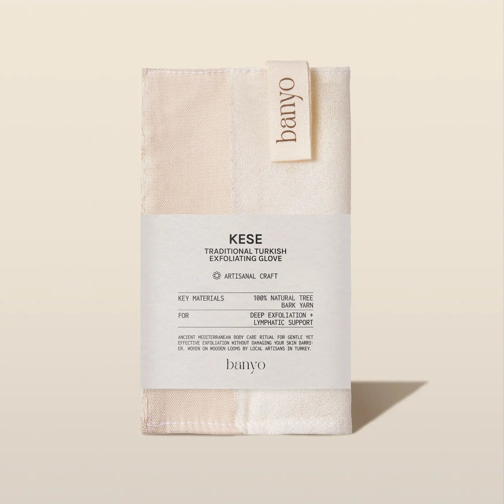Banyo Kese exfoliating glove packaging on a beige background
